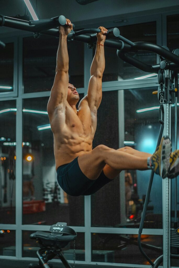 Person performing a controlled push-up beside a backpack and resistance bands in a bright home workout space.